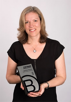 Heather Paulsen holding B Corp award