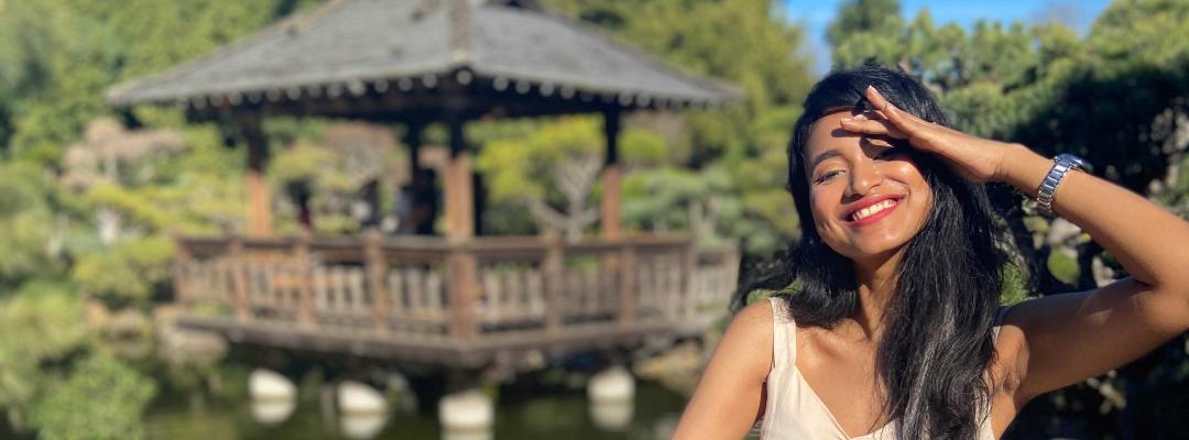 A girl standing in a Japanese tea garden