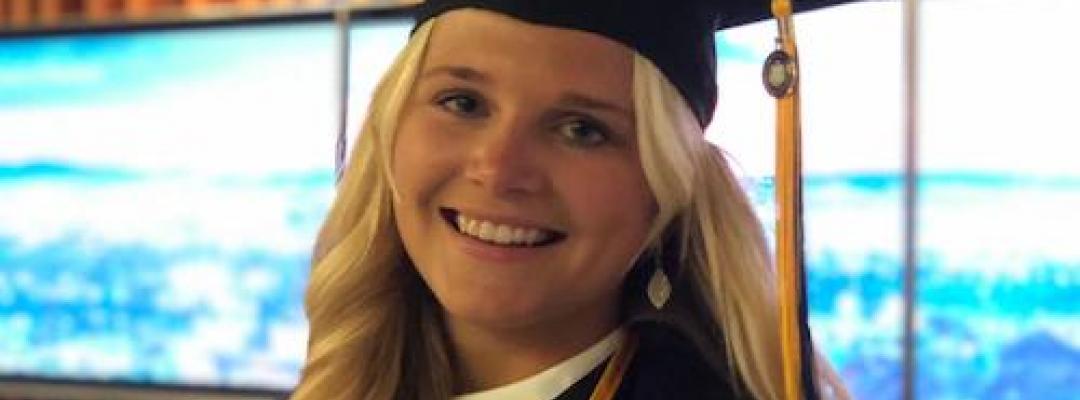 Anna Julia in her graduation cap and gown at the BHGAP closing ceremony