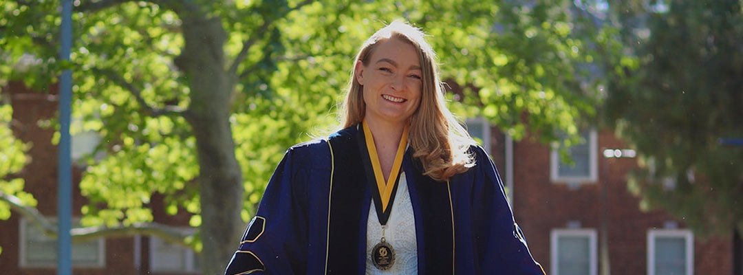 Post-Baccalaureate Health Professions Program alumna Anne edson Chiruvolu in her UC Davis School of Veterinary Medicine robes