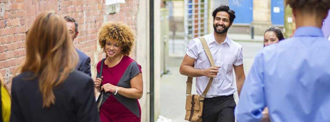 Young professionals walking down an alleyway