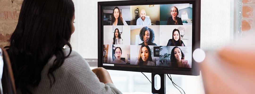 Black woman working from office on a teleconference call