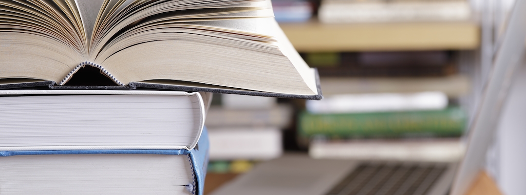 books stacked on top of each other