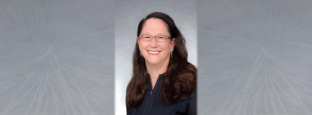 Accounting and auditing instructor Marjorie Bailey with gray background. Photo.