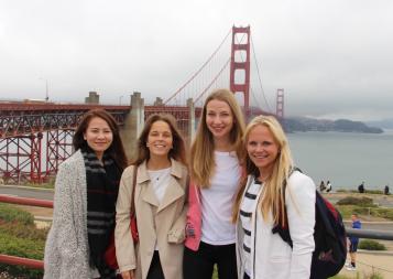 BHGAP student Anna Julia from Germany poses in front of the Golden Gate bridge on a foggy day with classmates.