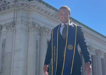 Harry Kenworthy wearing graduation robes