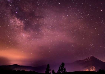 Image of pinkish sky with many stars visible