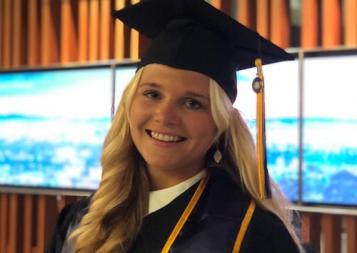 Anna Julia in her graduation cap and gown at the BHGAP closing ceremony