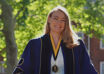 Post-Baccalaureate Health Professions Program alumna Anne edson Chiruvolu in her UC Davis School of Veterinary Medicine robes