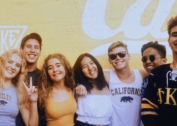 Berkeley undergraduates happily pose in their Cal gear.