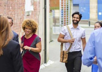 Young professionals walking down an alleyway