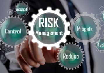 Graphical representation of risk management steps using gears labelled with Accept, Control, Mitigate, Reduce, and Avoid