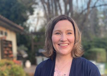 Professional Program in Child and Adolescent Treatment graduate Erin Richerson standing outside her home in California