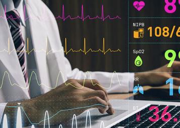 Chest-view stock photo of a male medical professional working on a laptop with medical records overlayed on shot