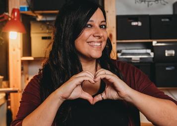 Italian American woman making a heart with her hands