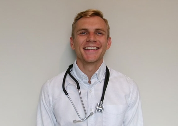 Post-Baccalaureate Health Professions Program alum Jason Veldman with stethoscope