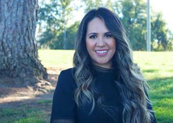 Kenia Macias standing outside in front of a tree