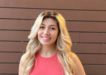 Certificate Program in Marketing graduate Marine Danielyan in front of painted brown wall