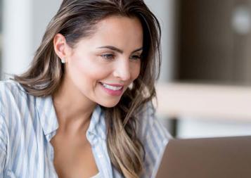 Photo of woman looking at laptop screen