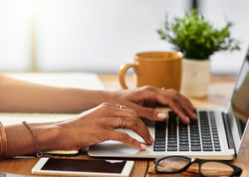 picture of woman's hands on a keyboard