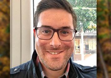 Headshot of Post-Baccalaureate Program for Counseling and Psychology Professions graduate Sam Kushner sitting in front of a window