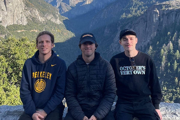 Eduardo Fatio and friends taking a photo in front of picturesque Yosemite National Park