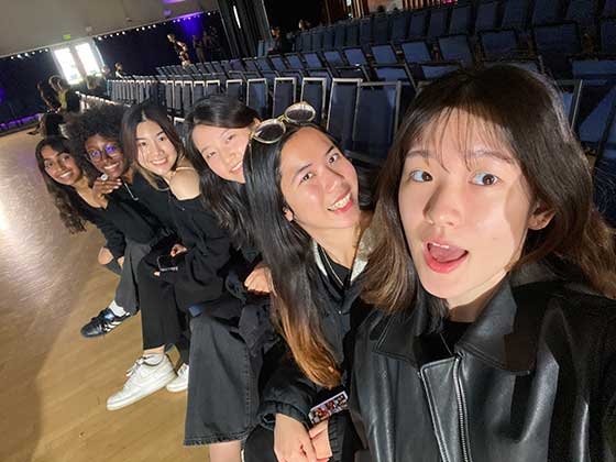 Mariane Iman Ndiaye and friends take a selfie at a theater